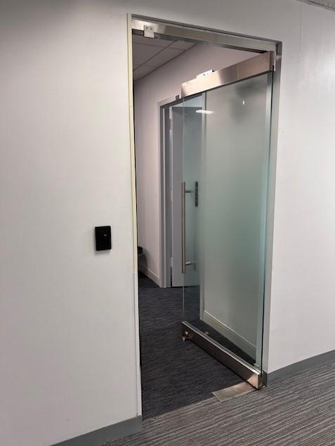 Locking glass entrance with key card access